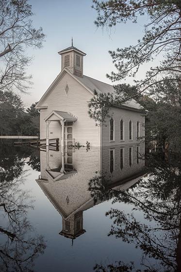 A church flooded by Hurricane Florence stands silently in its reflection in Burgaw, North Carolina, 2018<br/>