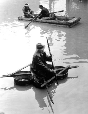 Photo: Flood Victim Paddling a Boat Made of Washtubs, Louisville, KY (?Time Inc.) Gelatin Silver print #1