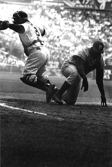 Photo: Brooklyn Dodger Jackie Robinson  steals home base against NY Yankees in the 8th inning of the 1st game of the World Series at Yankee Stadium, September 28, 1955 Gelatin Silver print #1239