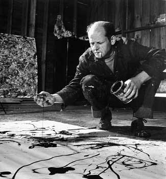 Jackson Pollock Painting in his Studio, Springs, NY, 1949 by Martha Holmes