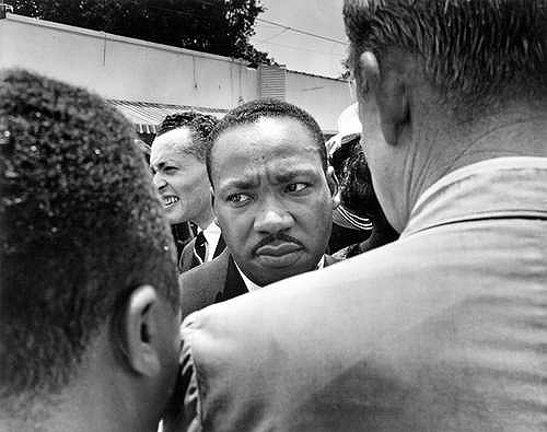 Dr.Martin Luther King, Jr. is stopped by police at Medgar Evers' funeral, Jackson, MS, June, 1963
