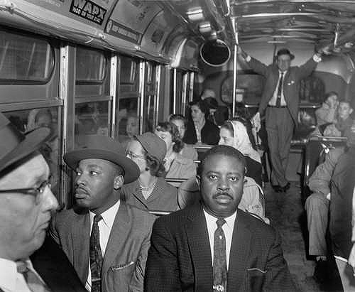 Dr. Martin Luther King Jr. and Rev. Ralph Abernathy ride on one of the first desegregated buses, Montgomery, AL  December 21, 1956