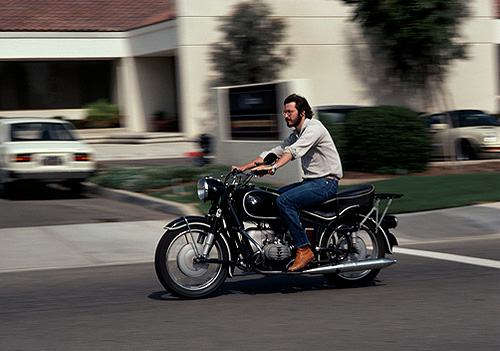 Charles O'Rear -- Apple computer co-founder Steve Jobs rides a motorcycle at age 27, California