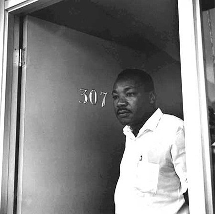 Dr. Martin Luther King, Jr. opening door of Room 307 of the Lorraine Motel, Memphis, TN, 1966