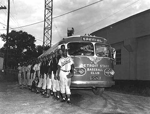 Detroit Stars and team bus outside Martin Stadium (owned by Ted Raspberry), 1953