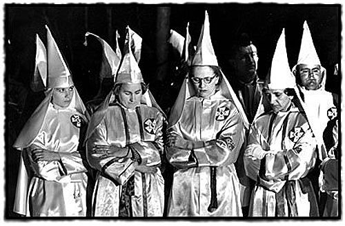 Woman of the Klan bow their heads in prayer at a rally near Salisbury, North Carolina, 1965