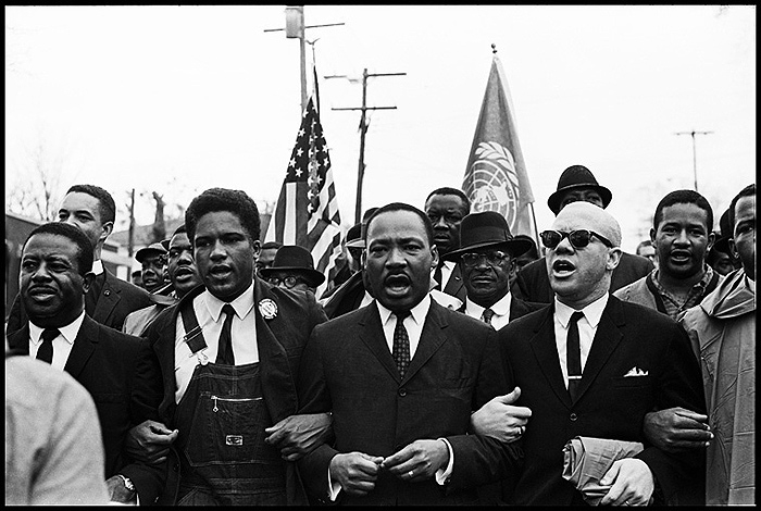 Dr. King leads the Freedom March along with Ralph Abernathy, James Forman and Reverend Jessie Douglas around the State Capitol in Montgomery, 1965