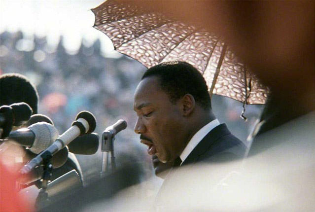 Martin Luther King speaking speaking at Soldier Field in Chicago during a large "freedom rally" which focused on housing discrimination, 1966