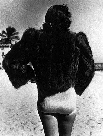 Woman wearing fur jacket during cold spell, Miami Beach, Florida, 1940<br/>