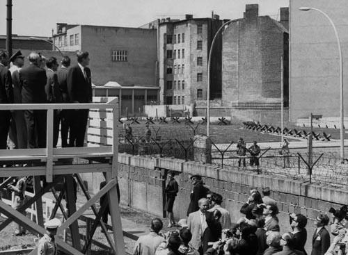 President John F. Kennedy looking over  Berlin wall to Eastern Sector, 1963<br/>