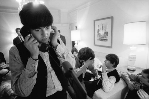 Paul McCartney on the Phone, Plaza Hotel, NYC, Feb 7, 1964. Copyright Bill Eppridge