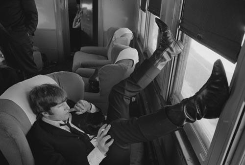 John Lennon. Train to D.C. Feb 10, 1964.  Copyright Bill Eppridge Gelatin Silver print