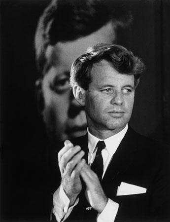 Robert F. Kennedy in front of a poster of his brother, Columbus, Ohio, 1968<br/>