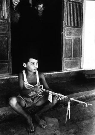 Vietnamese Child with Bamboo toy gun, Loc Dien, South Vietnam, 1965<br/>