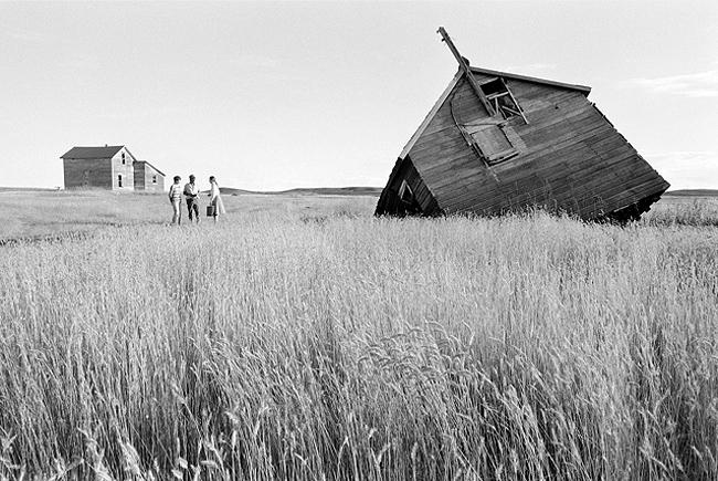 Farmers Randy & Lois Oster speak with lawyer activist Sarah Vogel on their farm, which is facing foreclosure, North Dakota, 1982 Archival Pigment Print