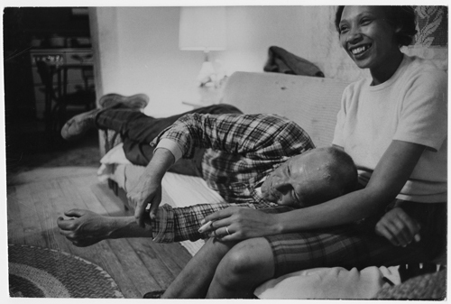 Richard and Mildred Loving laughing and watching television in their living room, King and Queen County, Virginia
