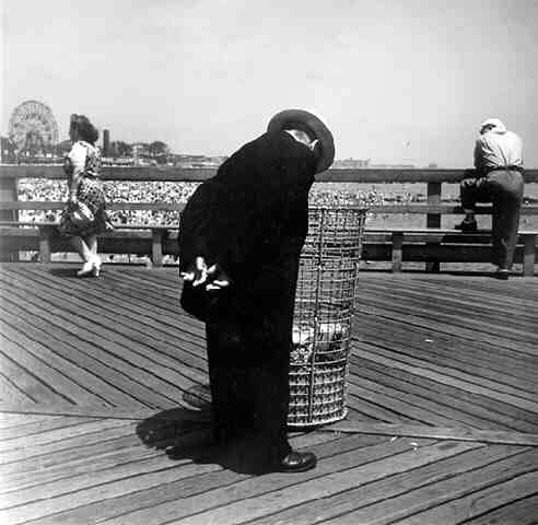 Man Looking in Waste Basket, Coney Island, NY, 1945