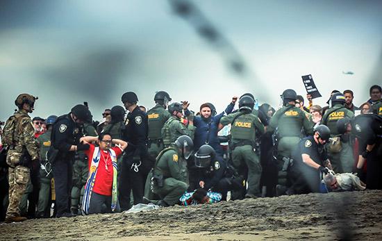 Religious leaders being arrested for peacefully protesting the immigration policies of the Trump administration, on the border near San Diego, California, December 10, 2018<br/>