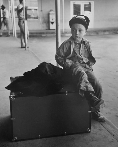 Boy on suitcase, Houston, Texas, 1950
