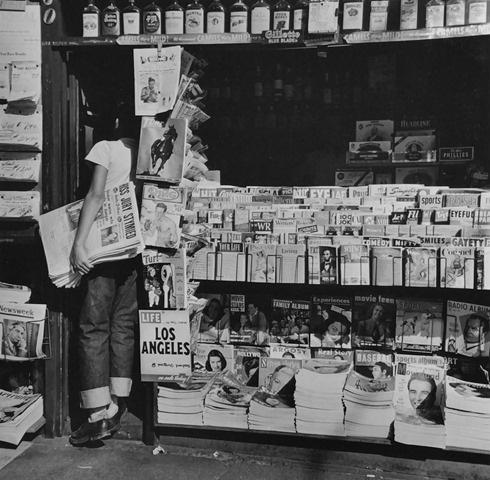 Newsboy at LA Newsstand, Los Angeles,1950 Gelatin Silver print