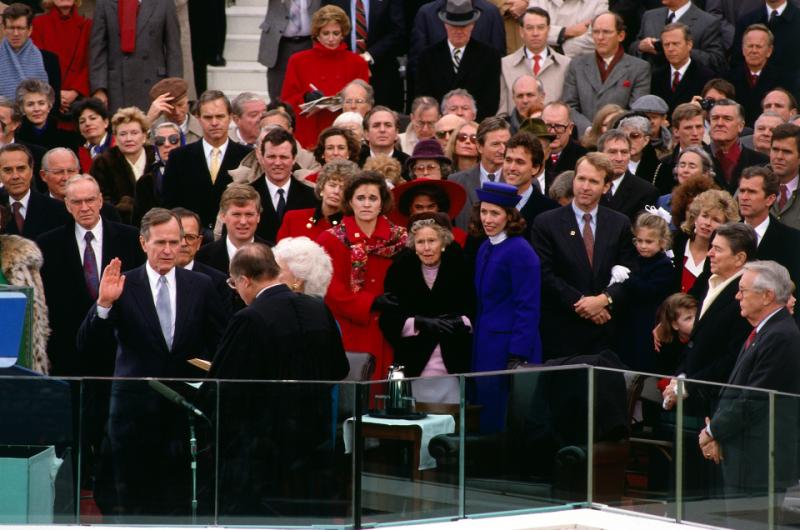 United States President George H.W. Bush takes the oath of office during the Inauguration Day ceremony on the West Front of the Capitol Building. Washington, DC, January 20, 1989 Chromogenic print