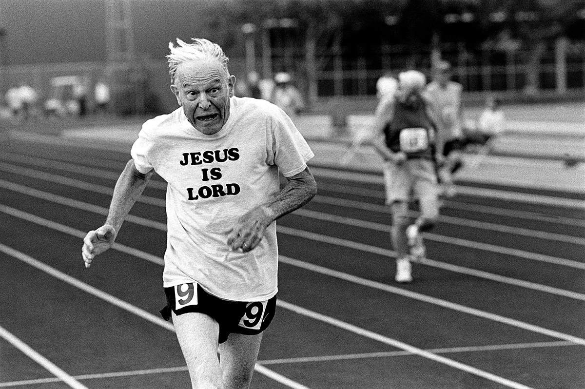 Photos A sprinter crosses the finish line during a track event during