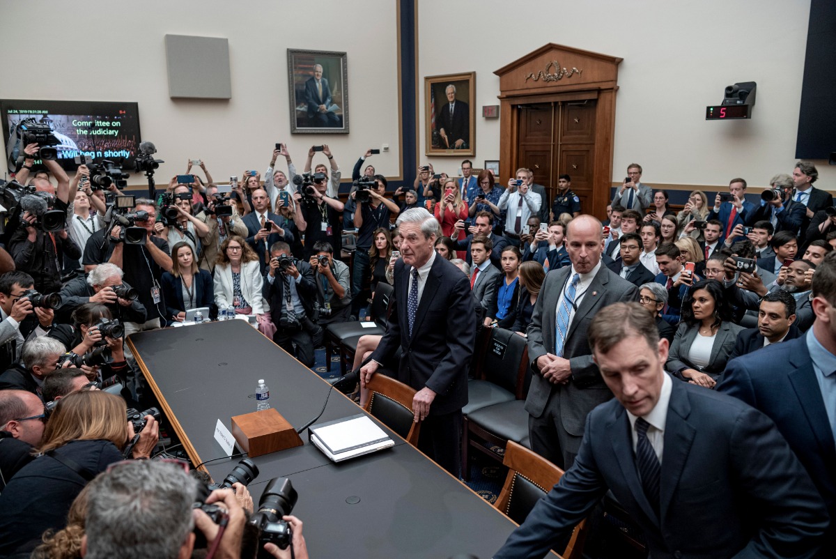 July 24,2019. Special Counsel Robert Mueller is surrounded by press