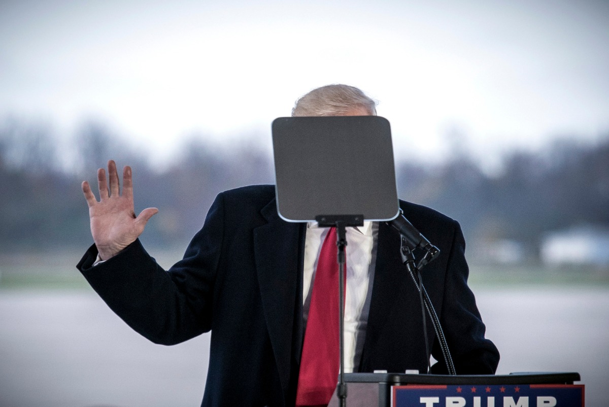 November 4,2016. Candidate Donald Trump's face is obscured by Teleprompter screen at a rally in an airplane hanger in in Wilmington, Ohio, a few days before he would win the presidency