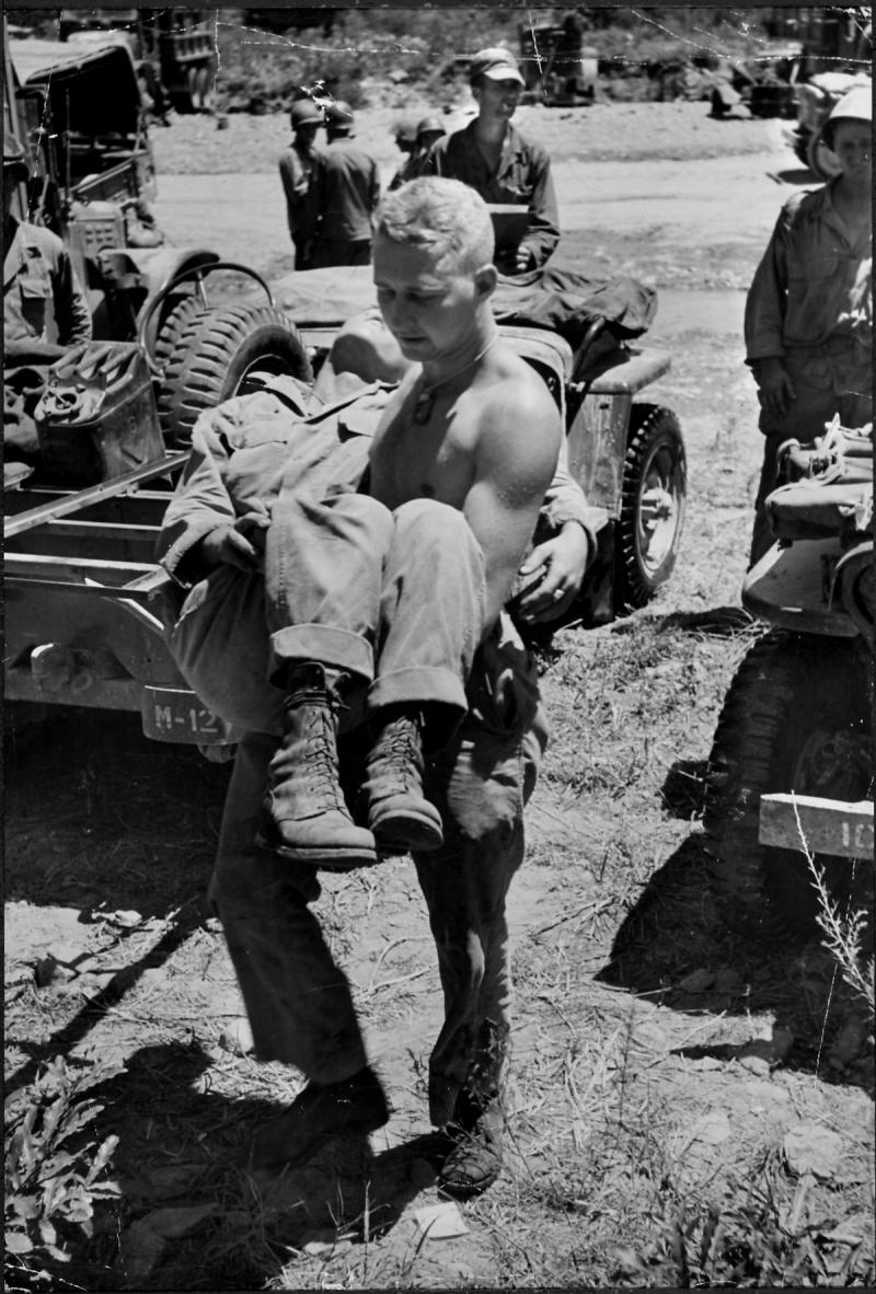 Photo: Corpsman Carries Wounded GI to Medical Station Near Kwan-ni, Korea, 1950 Gelatin Silver print #2712