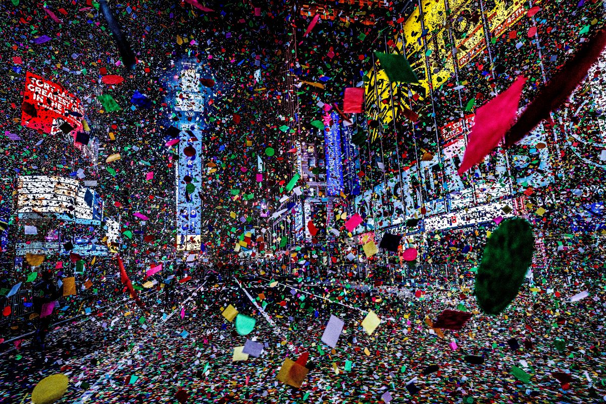 Confetti rains down on a mostly empty Time Square at midnight and the start of 2021