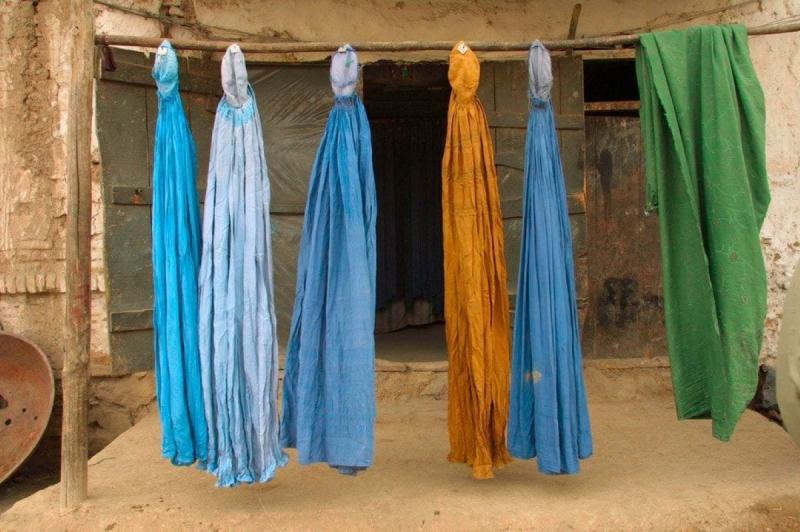 Photo: Burqas dry outside on a street. Kabul, Afghanistan 2001 Archival Pigment Print #2959