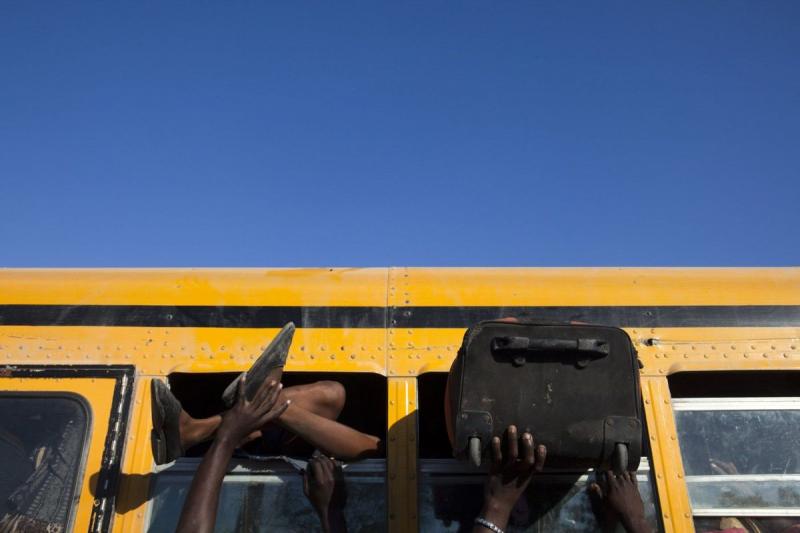 Photo: Haitians flee for the countryside after an earthquake killed several hundred thousand people.  Port au Prince, Haiti 2010 Archival Pigment Print #2962