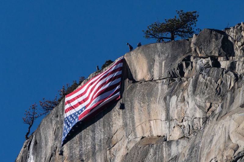 An upside-down American flag hangs from El Capitan near Yosemite National Park’s Horsetail Falls to protest the thousands of federal job cuts made by President Donald Trump’s administration, February 22, 2025<br/>Please contact Gallery for price