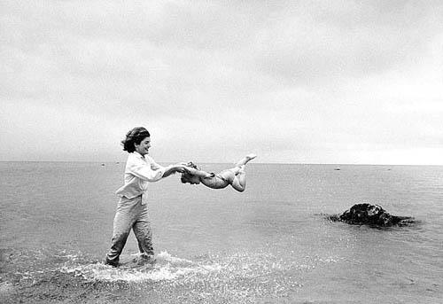 Jacqueline Kennedy swinging Caroline in surf, Hyannis Port, 1959 Vintage Gelatin Silver Print