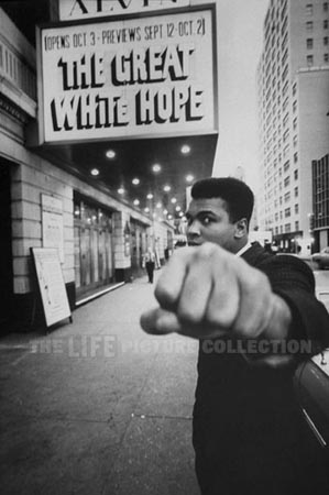 Boxing champion Muhammad Ali  posing in front of the Alvin Theater during production of play "The Great White Hope", NY, 1968