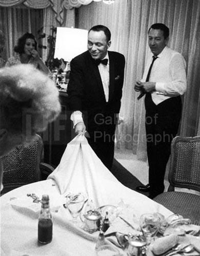 Frank Sinatra yanks tablecloth, Miami, 1965 Gelatin Silver print