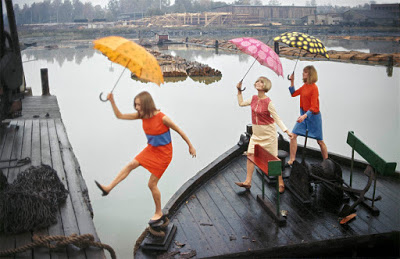 color photograph of Merimekko models with umbrellas