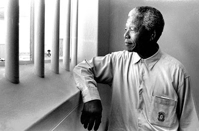 Nelson Mandela revisits his cell on Robben Island, 1994