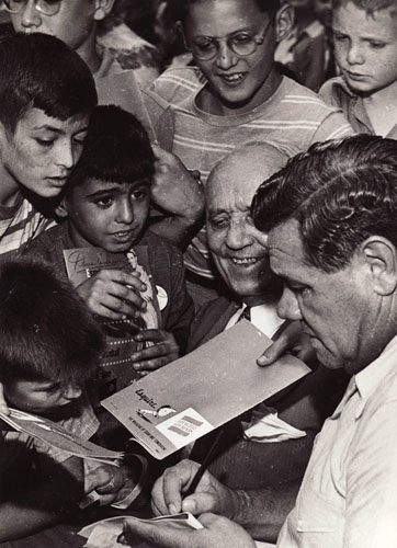 Babe Ruth signing autographs for adoring fans, New York